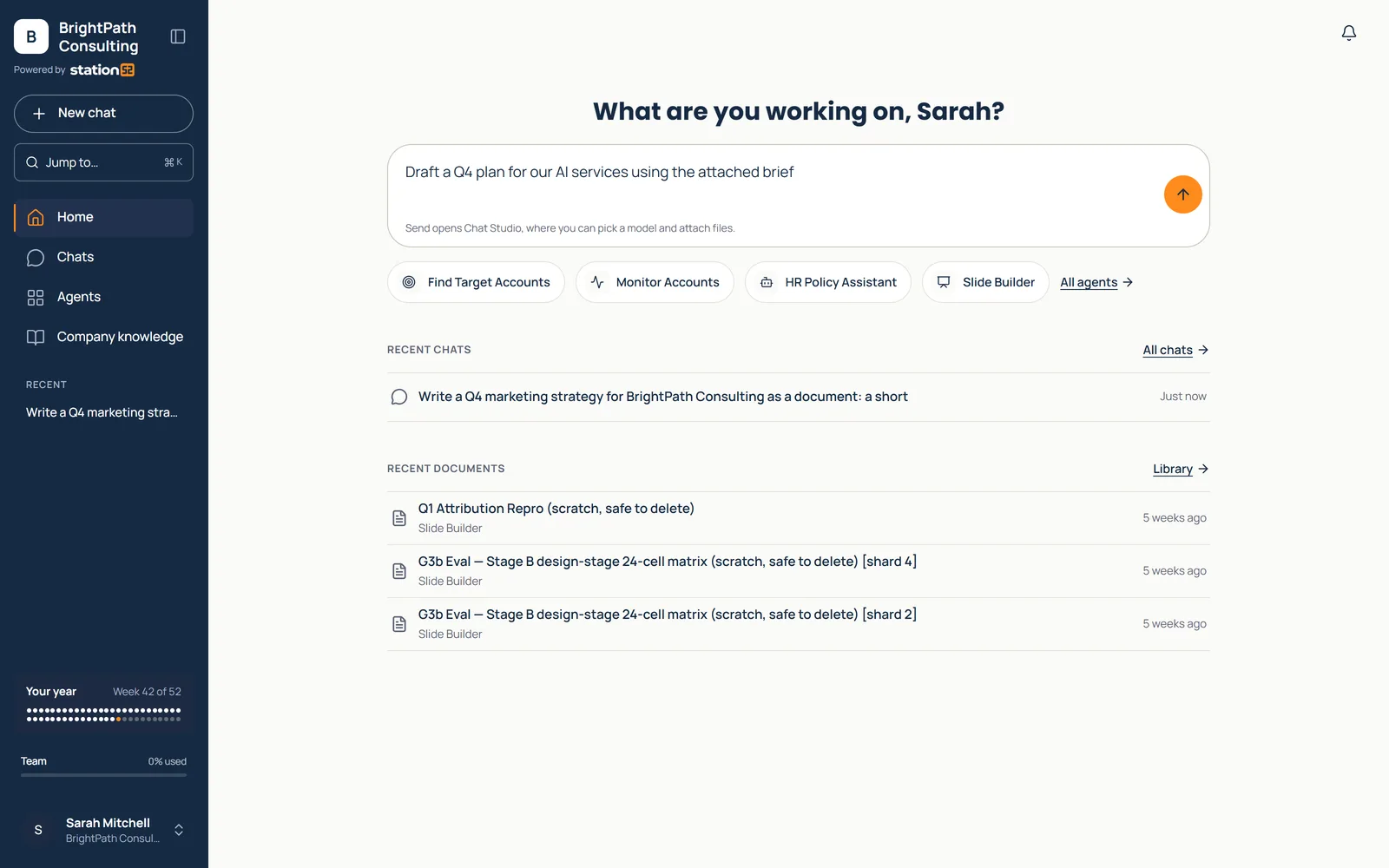 Station52 Workspace home: a greeting, a chat box with a Q4 plan request, and four favorite agents